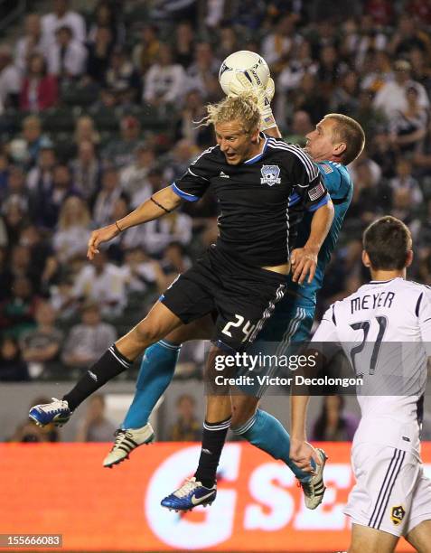 Goalkeeper Josh Saunders of the Los Angeles Galaxy makes the save as Steven Lenhart of the San Jose Earthquakes tries for the header in the first...