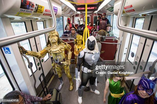 Cosplayers from the Science Fiction Coalition ride the trolley to help promote the use of San Diego Metropolitan Transit System to visit Comic-Con...