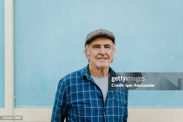 portrait of an elderly man wearing a beret - beret cap stock pictures, royalty-free photos & images