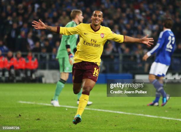 Theo Walcott of Arsenal celebrates after scoring his team's first goal during the UEFA Champions League group B match between FC Schalke 04 and...