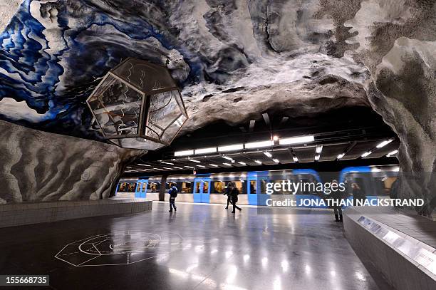 People wait for their trains at the Tekniska Hogskolan subway station on November 6, 2012 in Stockholm, Sweden, decorated in 1973 by artist Lennart...