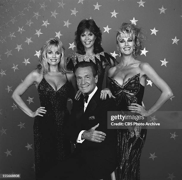 Host Bob Barker surrounded by the game show models, from left: Dian Parkinson, Holly Halstrom and Janice Pennington. Image Dated July 1, 1986