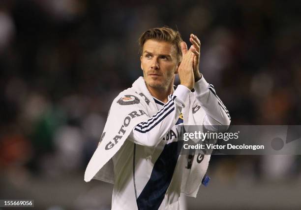 David Beckham of the Los Angeles Galaxy applauds the fans after the first leg of the MLS Western Conference Semifinal match against the San Jose...