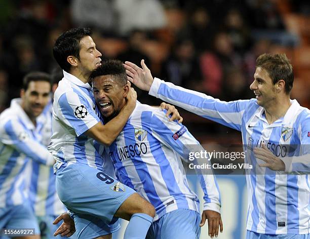 Eliseu of Malaga CF celebrates scoring the first goal during the UEFA Champions League group C match between AC Milan and Malaga CF at Stadio...