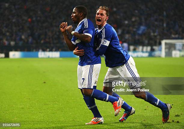 Jefferson Farfan of Schalke celebrates with his team mate Benedikt Hoewedes after scoring his team's second goal during the UEFA Champions League...