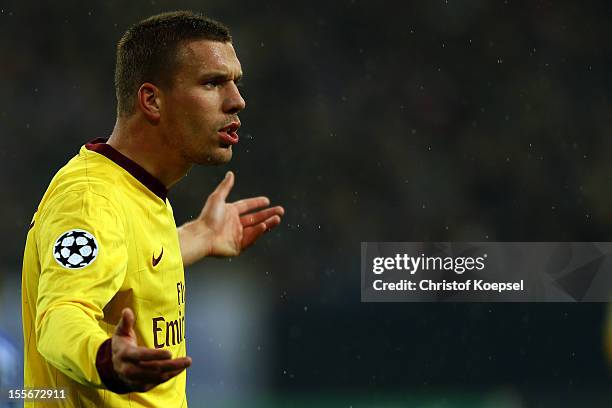 Lukas Podolski of Arsenal shows emotions during the UEFA Champions League group B match between FC Schalke 04 and Arsenal FC at Veltins Arena on...