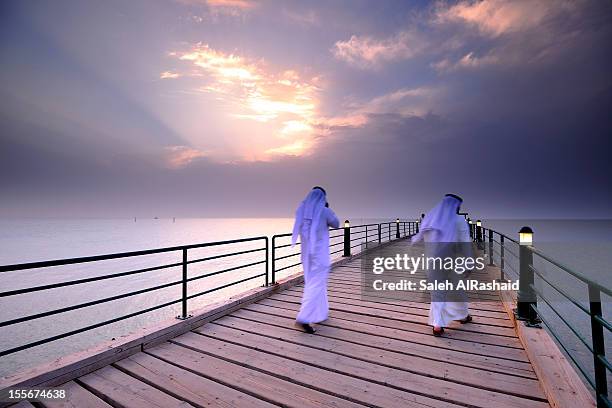 kuwaiti citizien walking - kuwait fotografías e imágenes de stock