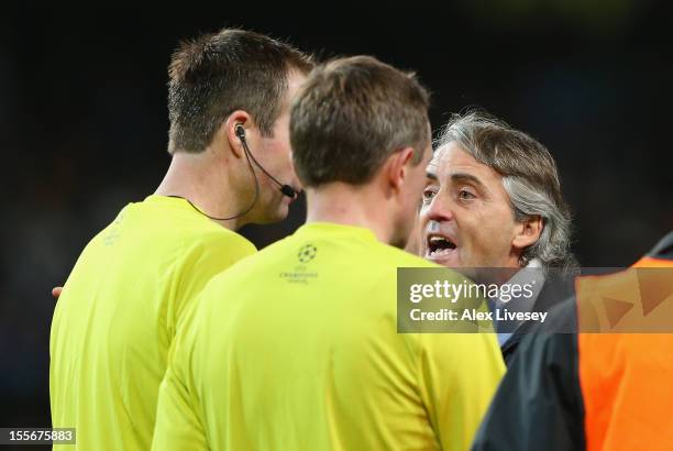 Manchester City Manager Roberto Mancini protests to Referee Peter Rasmussen after he denied his team a penalty at th eend of the UEFA Champions...