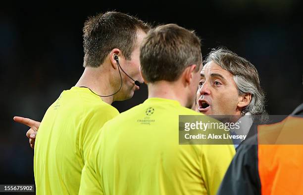 Manchester City Manager Roberto Mancini protests to Referee Peter Rasmussen after he denied his team a penalty at th eend of the UEFA Champions...