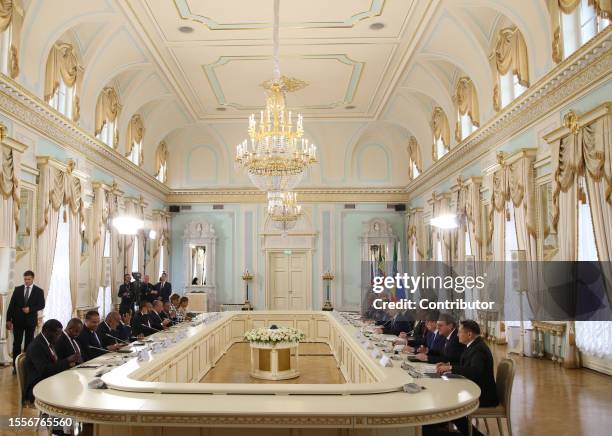 Russian President Vladimir Putin speaks as Ethiopian Prime Minister Abiy Ahmed looks on during a Russian-Ethiopian talks at the Konstantin Palace, on...