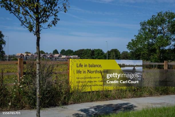 Banner advertising the benefits of Northstower is displayed on July 26, 2023 in Northstowe, England. The newly-built sustainable Cambridgeshire town...