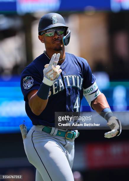 Julio Rodriguez of the Seattle Mariners hits a solo home run against the Minnesota Twins in the third inning at Target Field on July 26, 2023 in...