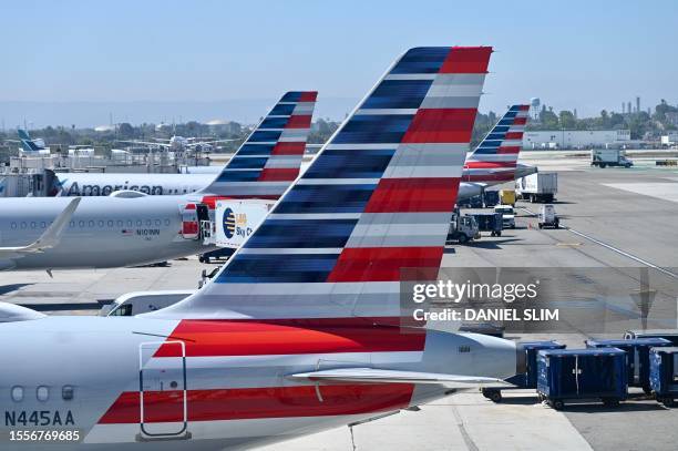 American Airlines planes sit at the gate at Los Angeles International Airport in Los Angeles, California, on July 26, 2023.