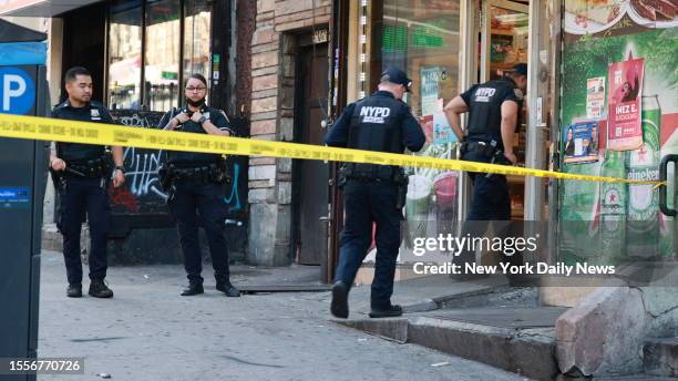 July 25: NYPD 26th Precinct and ESU Officers are seen looking for evidence at Mini Market located at 1465 Amsterdam Avenue early Tuesday July 25,...