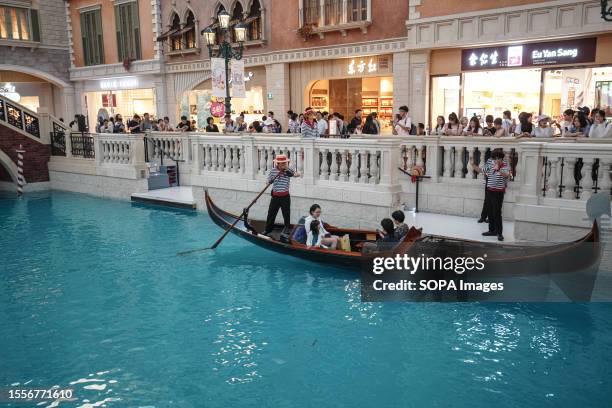 Boat is seen on a river inside The Venetian, one of the famous casino hotels in Macao Special Administrative Region.