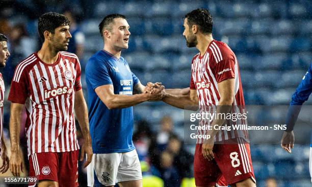 Rangers' John Souttar shakes hands with Olympiacos' Vicente Iborra during a pre-season friendly between Rangers and Olympiacos at Ibrox Stadium, on...
