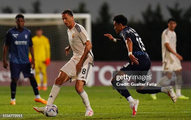 Nemanja Matic of AS Roma with Vitor Carvalho of SC Braga in action during the Pre-Season Friendly match between AS Roma and SC Braga at Estadio...