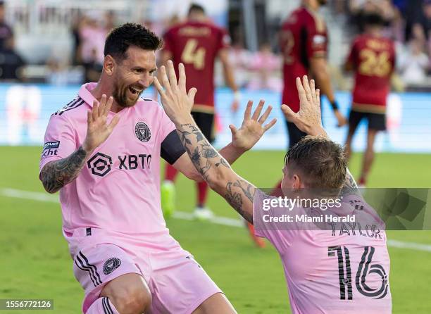 Inter Miami forward Lionel Messi celebrates with Inter Robert Taylor after scoring a second goal against Atlanta United in the first half of their...