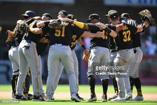 Pittsburgh Pirates players huddle after the Pirates beat the San Diego Padres 3-2 in a baseball game July 26, 2023 at Petco Park in San Diego,...