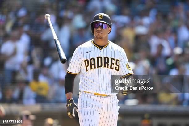 Juan Soto of the San Diego Padres flips his bat after walking during the ninth inning of a baseball game against the Pittsburgh Pirates July 26, 2023...