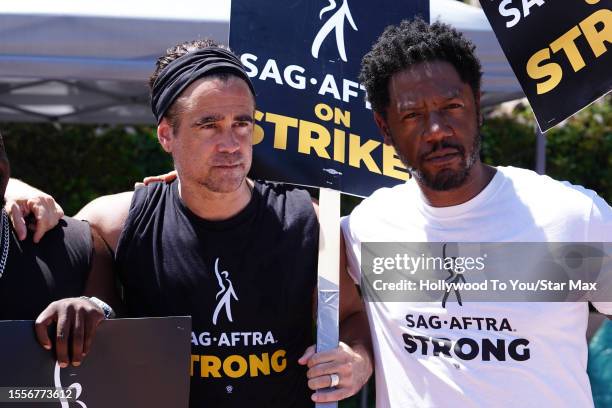 Colin Farrell and Tory Kittles walk the picket line in support of the SAG-AFTRA and WGA strike on July 26, 2023 in Los Angeles, California.