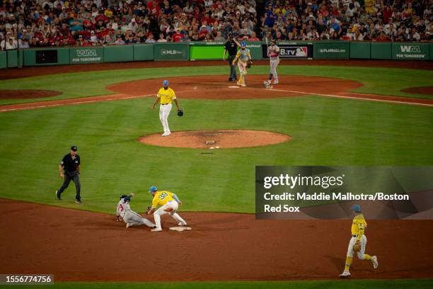 Christian Arroyo of the Boston Red Sox catches Forrest Wall of the Atlanta Braves stealing during the ninth inning of a game on July 26, 2023 at...