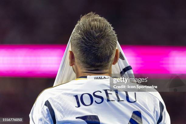 Real Madrid forward Joselu Mato puts his jersey over his head after missing a chance on goal during the Soccer Champions Tour match between Real...