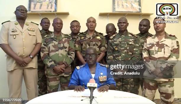 Screen grab captured from a video shows the soldiers who appeared on national TV to announce the ouster of President Mohamed Bazoum in Niger, on July...