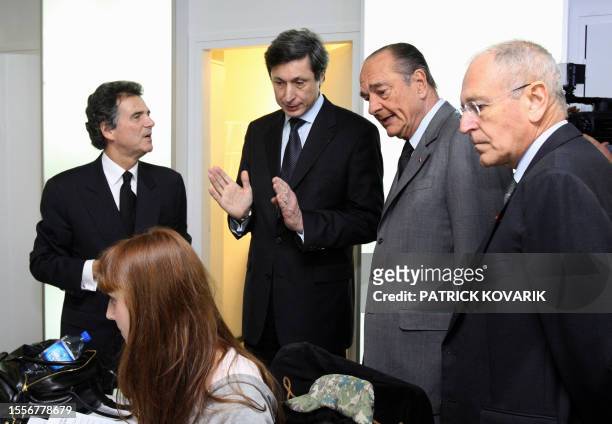 French President Jacques Chirac speaks with the president of the new French-international news TV channel France 24, Alain de Pouzilhac , the...
