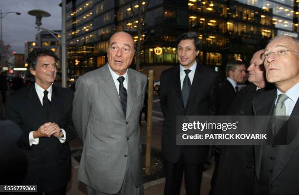 French President Jacques Chirac poses with the president of the new French-international news TV channel France 24, Alain de Pouzilhac , the...