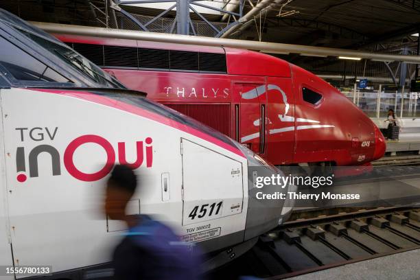 InOui and a Thalys wait for passenger Brussels-South railway station on July 25 in Brussels, Belgium. TGV INOUI has gradually replaced traditional...