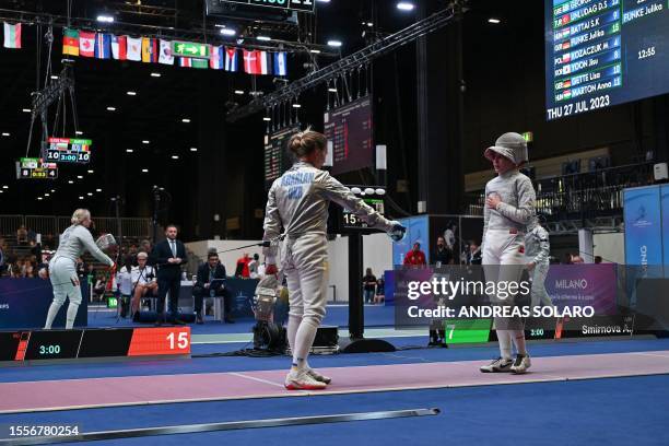 Ukraine's Olha Kharlan gestures as she refuses to shake hands with Russia's Anna Smirnova, registered as an Individual Neutral Athlete , after she...