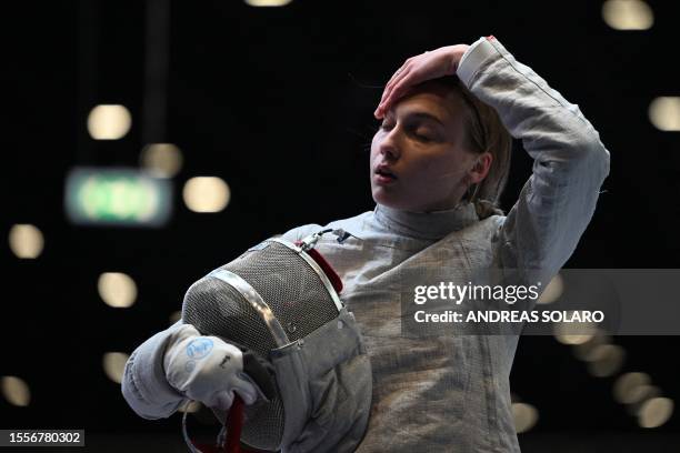 Russia's Anna Smirnova, registered as an Individual Neutral Athlete , reacts as she competes against Ukraine's Olha Kharlan during the Sabre Women's...