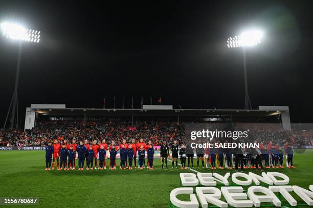 Portugal and Vietnam players stand for their national anthem before the start of the Australia and New Zealand 2023 FIFA Women's World Cup Group E...