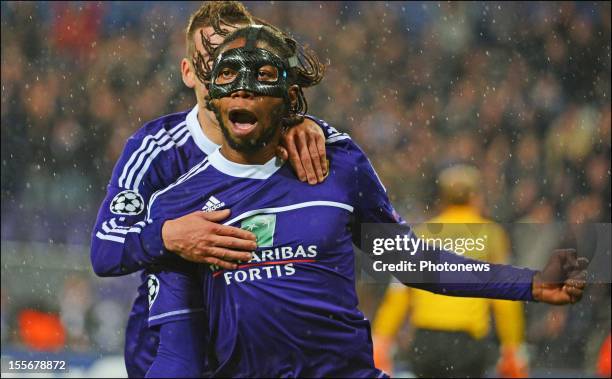 Dieudonne Mbokani of RSC Anderlecht celebrates after scoring the opening goal of the UEFA Champions League Group C match between RSC Anderlecht and...