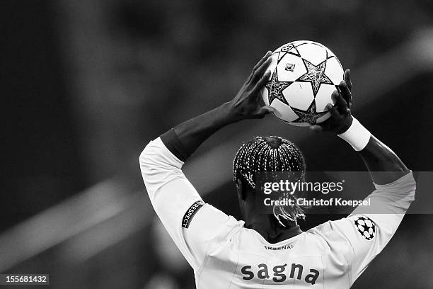 Bacary Sagna of Arsenal does a throw-in during the UEFA Champions League group B match between FC Schalke 04 and Arsenal FC at Veltins Arena on...