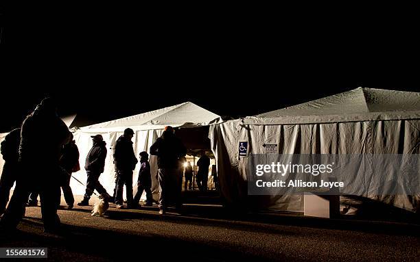 People vote in the presidential elections in a tent in Midland Beach November 6, 2012 in the Staten Island borough of New York City. As Staten Island...