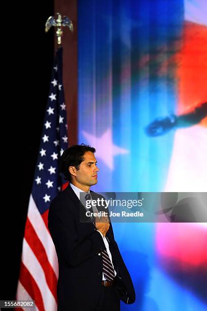 Craig Romney, son of Republican presidential candidate, Mitt Romney, listens to the National Anthem being sung during Mitt Romney's campaign election...