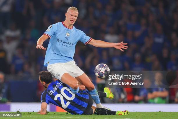 Hakan Calhanoglu of FC Internazionale Milano, Erling Haaland of Manchester City during the UEFA Champions League Final match between Manchester City...