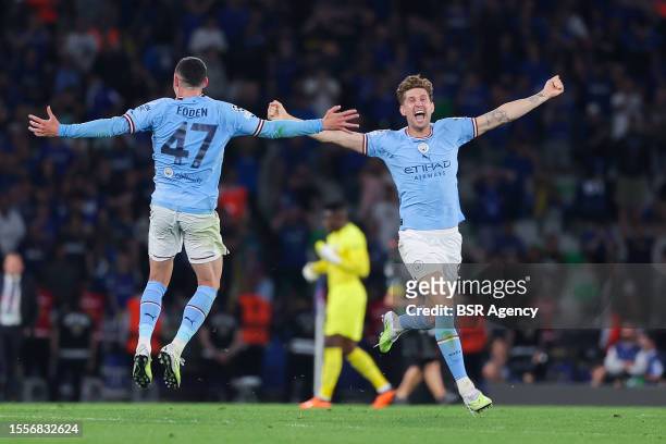 Phil Foden of Manchester City, John Stones of Manchester City celebrating the win during the UEFA Champions League Final match between Manchester...