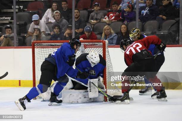 Robert Farnham of Team Johnston and Brandon Halverson of Team Johnston block a shot by Tyler Murovich of Team Carbonneau during 3ICE Week 4 at the...