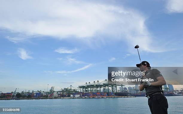 Rory McIlroy of Northern Ireland plays a shot during the pro - am prior to the start of the Barclays Singapore Open at the Sentosa Golf Club on...