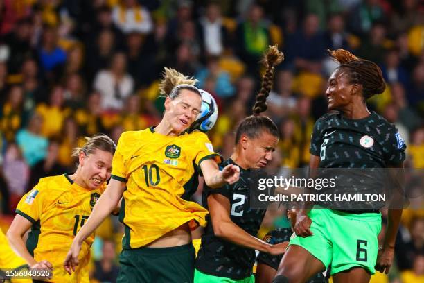 Australia's midfielder Emily Van Egmond , Nigeria's defender Ashleigh Plumptre , and Nigeria's forward Ifeoma Onumonu contest a header during the...