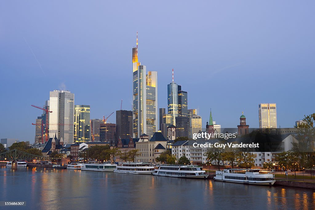 Skyline of Frankfurt with the river Main at dusk