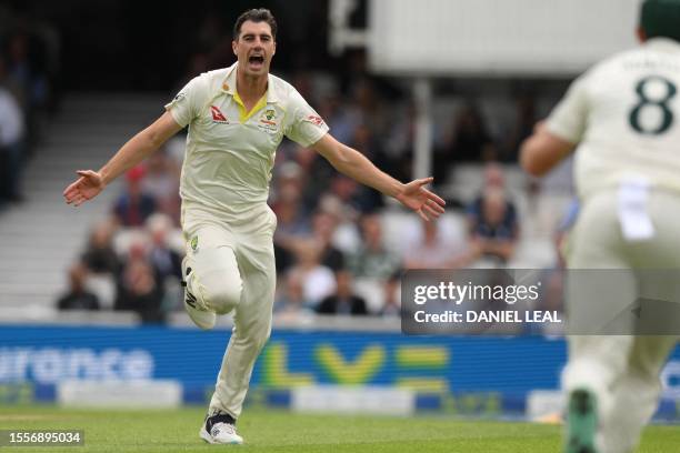 Australia's Pat Cummins celebrates after taking the wicket of England's Zak Crawley on the opening day of the fifth Ashes cricket Test match between...
