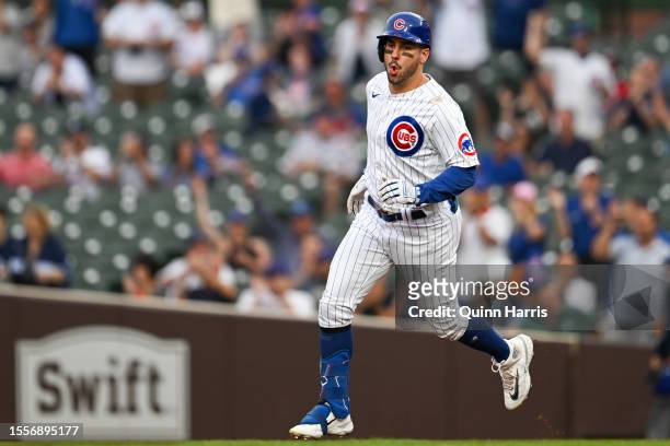 Mike Tauchman of the Chicago Cubs rounds the bases after his home run in the first inning against Trevor Williams of the Washington Nationals at...