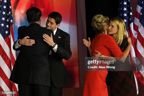 Republican presidential candidate, Mitt Romney, hugs Republican vice presidential candidate, U.S. Rep. Paul Ryan while his wife, Ann Romney, hugs...