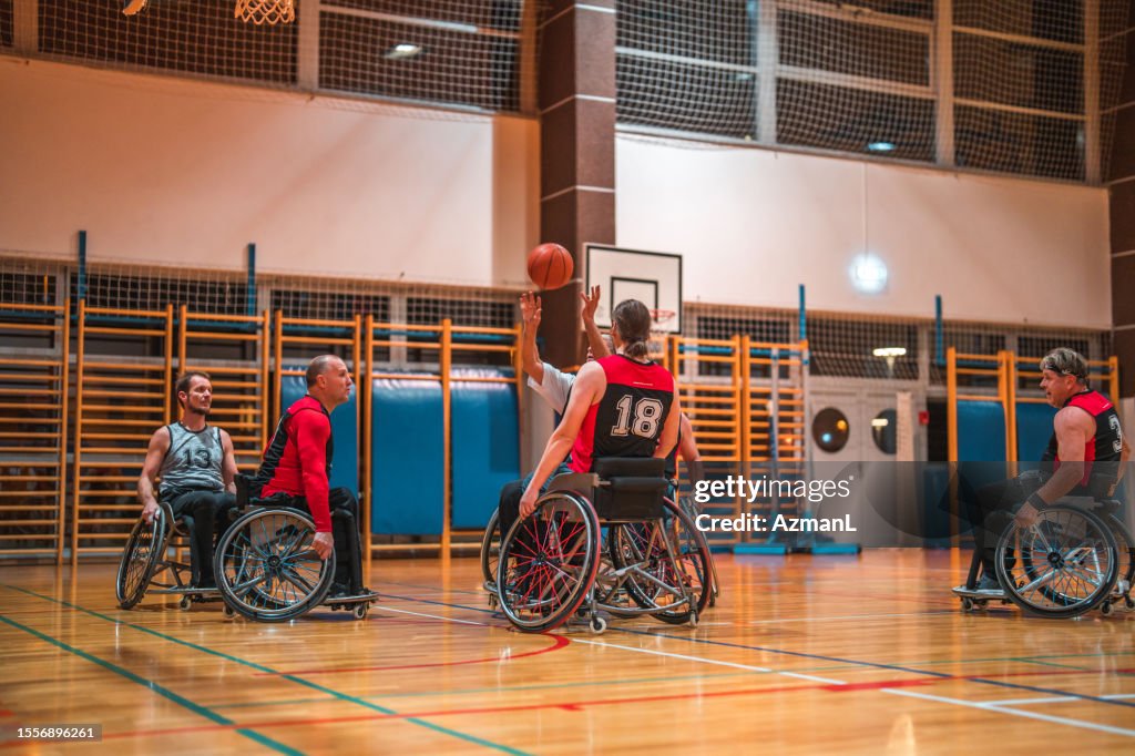Mature Caucasian Male Wheelchair Basketball Player Taking A Shot