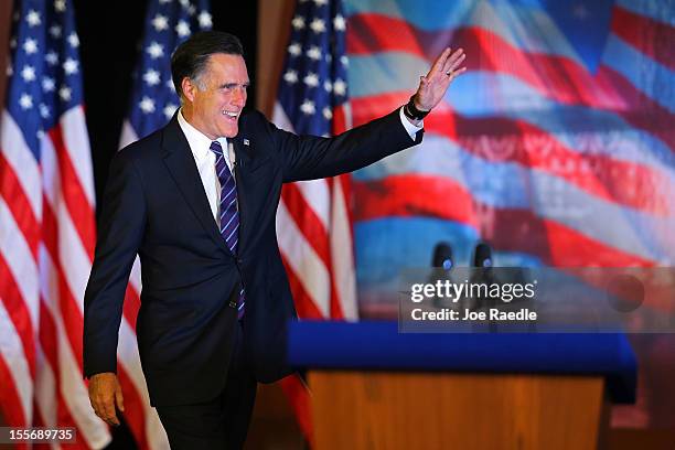 Republican presidential candidate, Mitt Romney, waves to the crowd before conceding the presidency during Mitt Romney's campaign election night event...