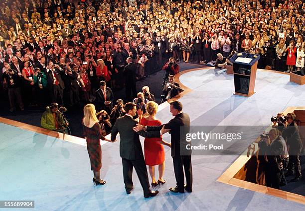 Republican presidential candidate, Mitt Romney , his wife Ann a and running mate U.S. Rep. Paul Ryan and his wife Janna on stage after conceding the...